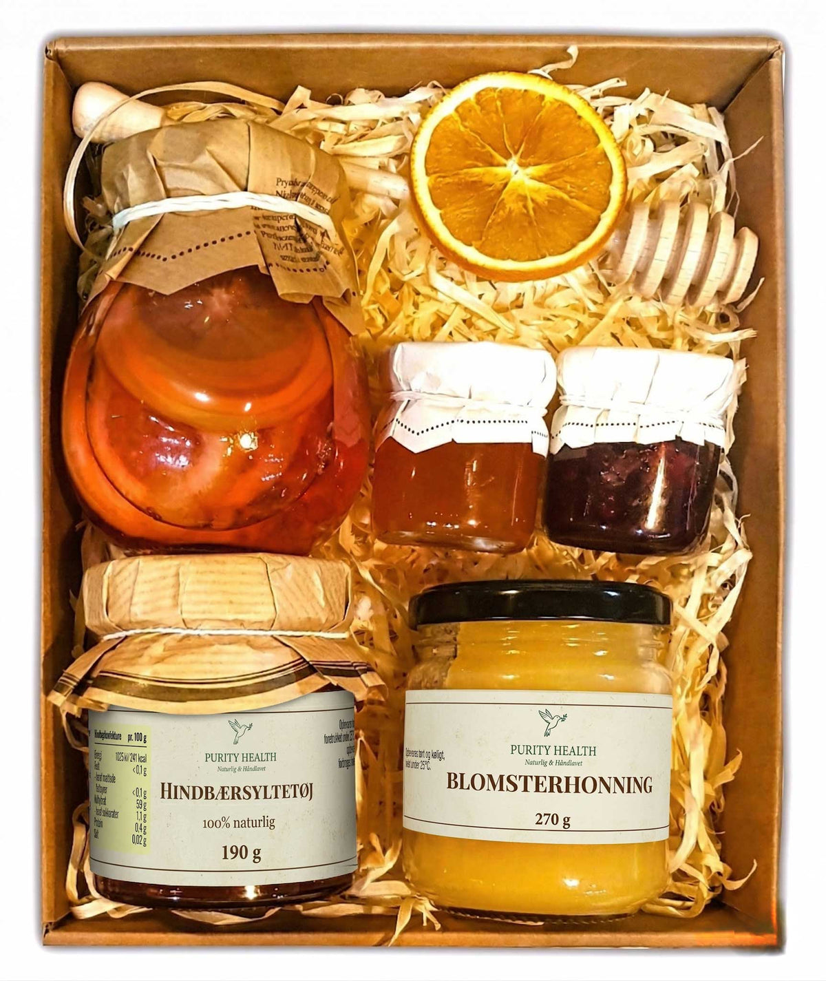Gavekurv med honning, marmelade og frugt i sirup