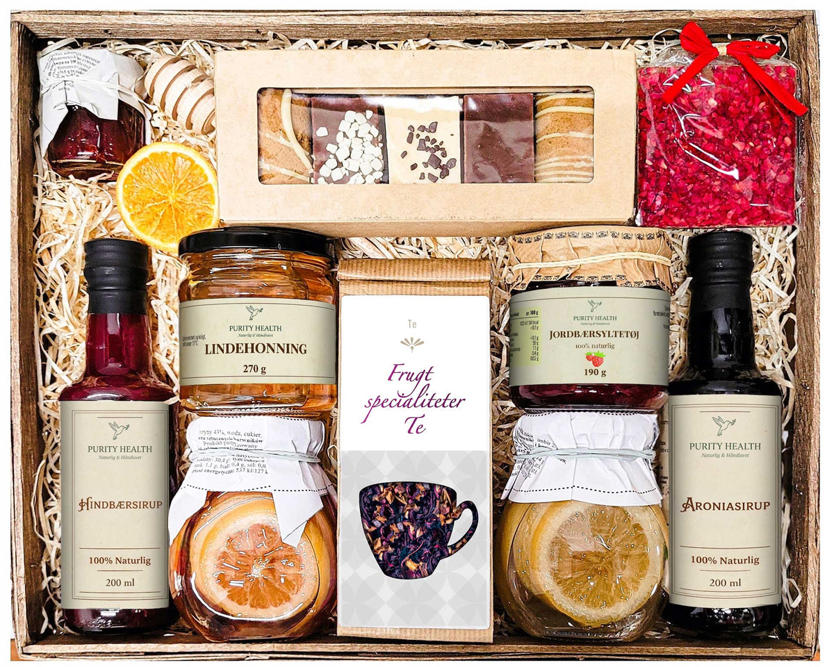 Gavekurv med te, honning, chokolade, sirup og marmelade