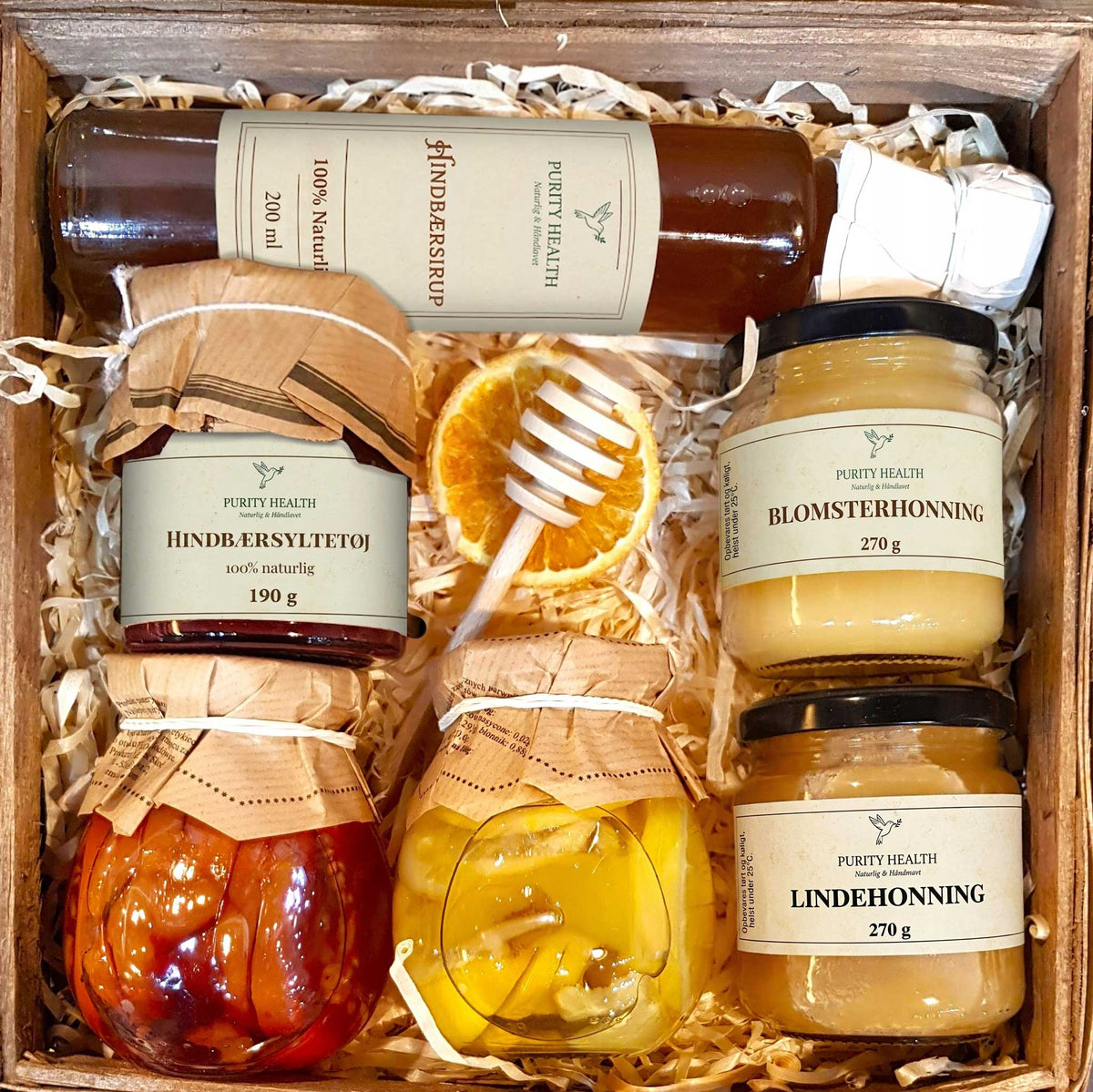 Gavekurv med honning, sirup, marmelade og frugt i sirup