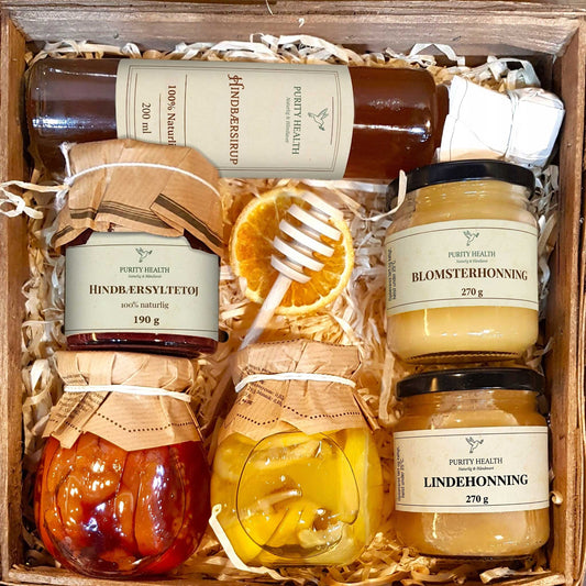 Gavekurv med honning, sirup, marmelade og frugt i sirup