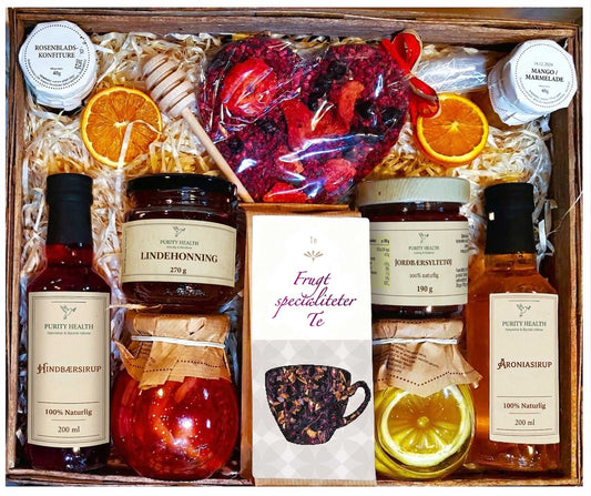 Gavekurv med te, honning, chokolade, sirup og marmelade
